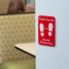 A red and white Tablecraft plastic sign that says "Thank You for Social Distancing"