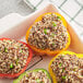 A group of peppers stuffed with Furmano's tri-color quinoa and peas.