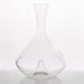 A clear glass decanter with a cone-shaped neck.