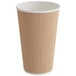 A brown paper cup with a white rim.