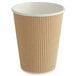 A brown paper hot cup with a white ripple.