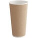 A brown paper cup with a white ripple rim.