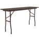 A brown rectangular Correll folding table with black legs.