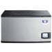 A grey rectangular Manitowoc air cooled ice machine with a black and silver lid.