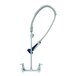 A chrome T&S pre-rinse faucet with a flexible hose.