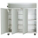 The left door of a Traulsen G Series reach-in refrigerator with a white door and black handle.