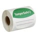 A roll of white paper with green TamperSafe labels.