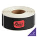 A roll of black TamperSafe paper labels.