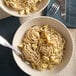 A bowl of Regal angel hair pasta with a fork.
