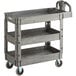 A Lavex gray plastic utility cart with three shelves.