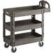 A black plastic Lavex utility cart with three shelves.