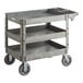 A gray plastic Lavex 3-shelf utility cart with wheels.