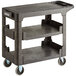 A black plastic utility cart with three shelves and wheels.