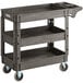 A black plastic Lavex utility cart with three shelves.