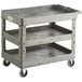 A Lavex large gray plastic utility cart with three shelves and wheels.