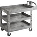 A Lavex gray utility cart with three shelves.