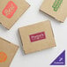 Three brown Choice cardboard boxes with a logo on them.