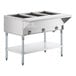 A stainless steel three-pan open well natural gas steam table with an undershelf and control knobs.