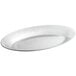 A white oval aluminum sizzler platter with a silver rim.