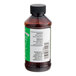 A close up of a brown LorAnn Oils Coconut Bakery Emulsion bottle with a black cap.