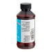 A close up of a brown LorAnn Oils Rum Bakery Emulsion bottle with a black cap.