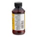 A close-up of a LorAnn Oils Butter Vanilla Bakery Emulsion bottle with a black cap and label.