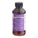 A close up of a bottle of LorAnn Oils Princess Cake and Cookie Bakery Emulsion with a purple label.