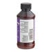 A close-up of a bottle of LorAnn Oils Princess Cake and Cookie Bakery Emulsion with a label.
