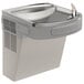 An Elkay light gray granite wall mount drinking fountain with a water dispenser.