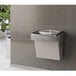An Elkay wall mount drinking fountain with a plant nearby.