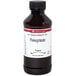 A bottle of LorAnn Oils Pomegranate Super Strength Flavor liquid with a label.