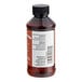 A close-up of a LorAnn Oils Maple Bakery Emulsion bottle with a white label.