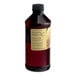 A close-up of a LorAnn Oils 16 fl. oz. bottle of Butter Vanilla Bakery Emulsion with a label.