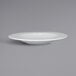 A close up of a RAK Porcelain white embossed wide rim deep porcelain plate.