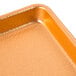 A Chicago Metallic Textured Copper Bakery Display Tray with a shiny finish.