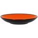 An orange and black RAK Porcelain deep coupe plate.