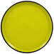 A yellow porcelain plate with a black rim.