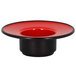 A red porcelain saucer with a black rim.