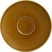 A brown RAK Porcelain saucer with a circle in the middle.