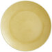 A close up of a RAK Porcelain Genesis glossy creme brule coupe plate.