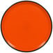 An orange RAK Porcelain rimless plate.