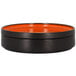 An orange rimless porcelain deep plate with a lid.