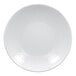 A bright white, round, embossed deep coupe porcelain plate.