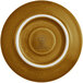 A close up of a RAK Porcelain caramel saucer with a white rim and gold accents.