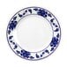 A white round melamine plate with blue lotus flowers on it.