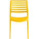 A Lancaster Table & Seating yellow resin side chair.
