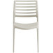 A beige plastic chair with a slatted back.
