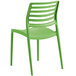 a green plastic chair with a white background