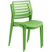 a green plastic chair with a white background