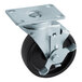 A black metal plate caster with black wheels.